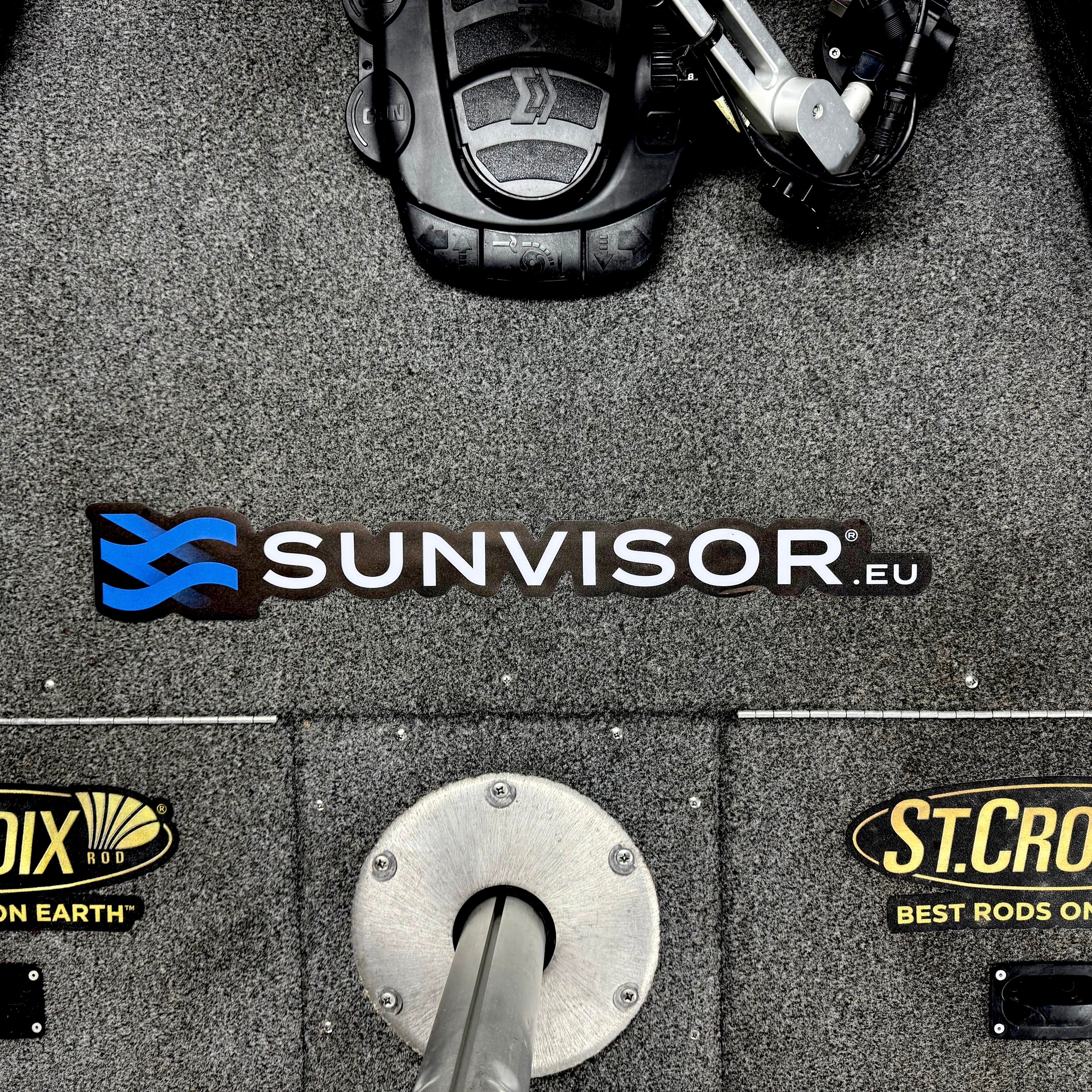 Close-up of Sunvisor carpet sticker on a boat&#39;s carpeted surface, showcasing durable and stylish design for interior preservation.